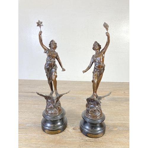 328 - A pair of vintage spelter figurines, one La Victoire and one La Travail - approx. 35cm high