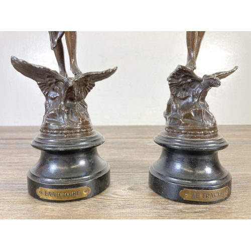 328 - A pair of vintage spelter figurines, one La Victoire and one La Travail - approx. 35cm high