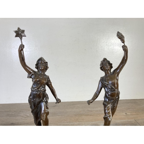 328 - A pair of vintage spelter figurines, one La Victoire and one La Travail - approx. 35cm high