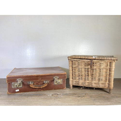 333 - Two items, one early 20th century brown leather suitcase and one wicker fishing basket - approx. 31c... 