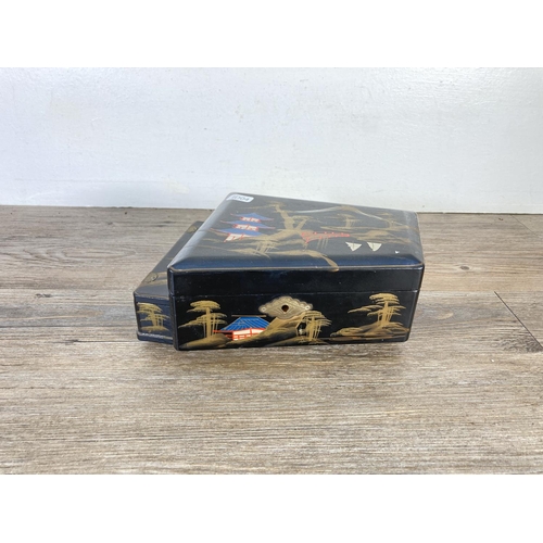 337 - A mid 20th century hand painted and black lacquered novelty grand piano musical jewellery box with t... 