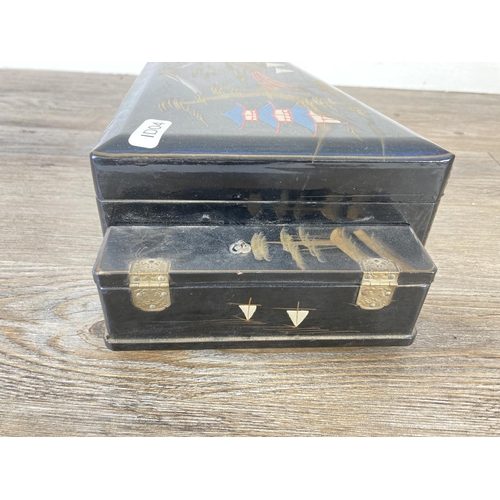 337 - A mid 20th century hand painted and black lacquered novelty grand piano musical jewellery box with t... 