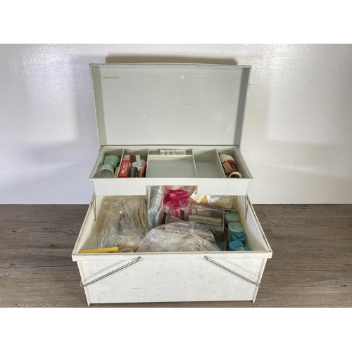 345 - A mid/late 20th century white plastic first aid box with contents - approx. 21cm high x 40cm wide x ... 