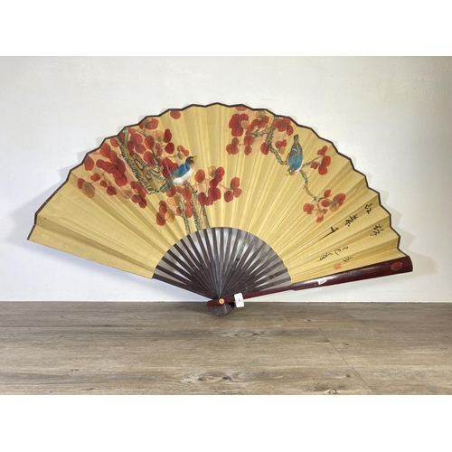 348 - A Chinese hand painted paper and bamboo fan supervised by the Chinese Fan Association - approx. 110c... 