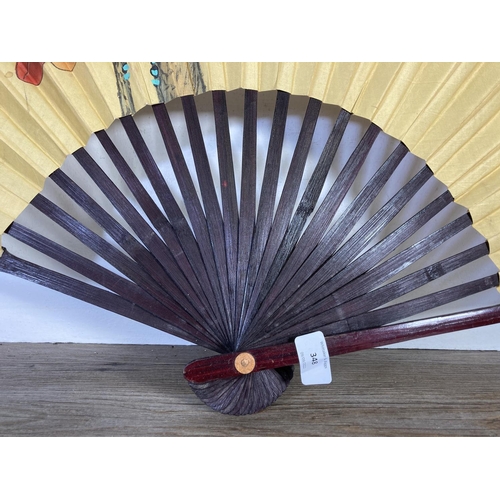 348 - A Chinese hand painted paper and bamboo fan supervised by the Chinese Fan Association - approx. 110c... 