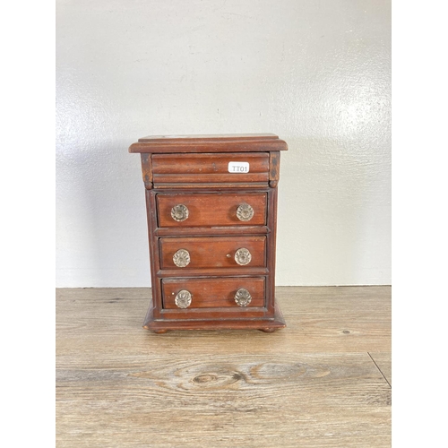 350A - An early 20th century mahogany miniature apprentice chest of three drawers with upper secret drawer ... 