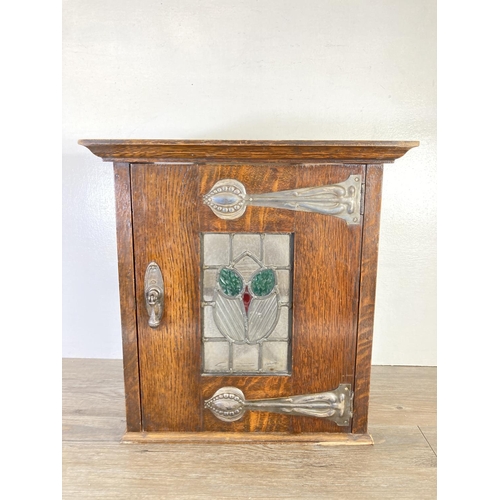 350F - An Arts & Crafts oak wall mountable cabinet with leaded and stained glass door - approx. 42cm high x... 