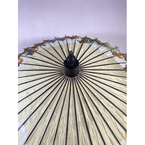 350G - Two oriental hand painted paper and bamboo items, one parasol - approx. 70cm in diameter and one fan... 