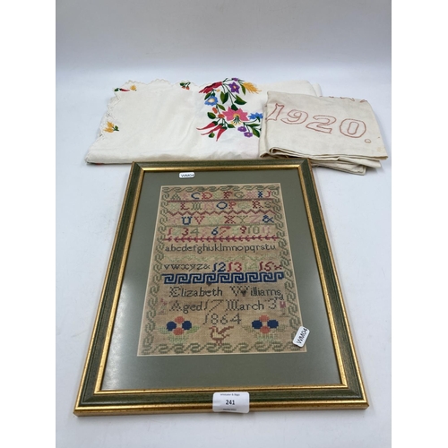 241 - Three embroidered items, one 19th century sampler by Elizabeth Williams dated 1864 - approx. 14cm x ... 