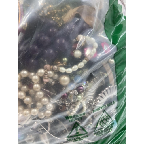 257 - Approx. 10kg of costume jewellery to include bangles, necklaces, rings, earrings etc.