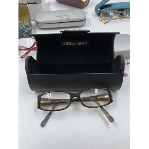 280 - A collection of assorted designer prescription glasses to include Gucci, Dior etc.