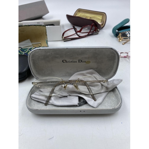 280 - A collection of assorted designer prescription glasses to include Gucci, Dior etc.