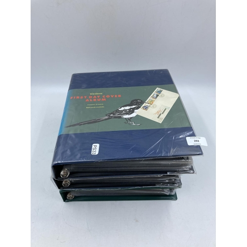 292 - Three albums containing a large collection of first day covers to include Peter Pan, The Bridges of ... 