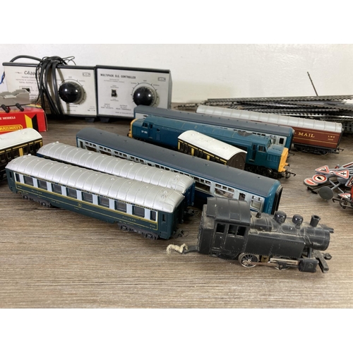 A collection of assorted 'OO' gauge model railway accessories to include Hornby carriages, Lima loco