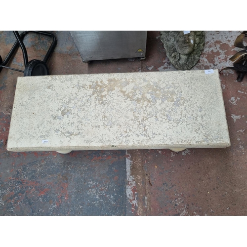 656 - A cast stone rectangular garden bench on Corinthian supports - approx. 43cm high x 95cm long x 36cm ... 