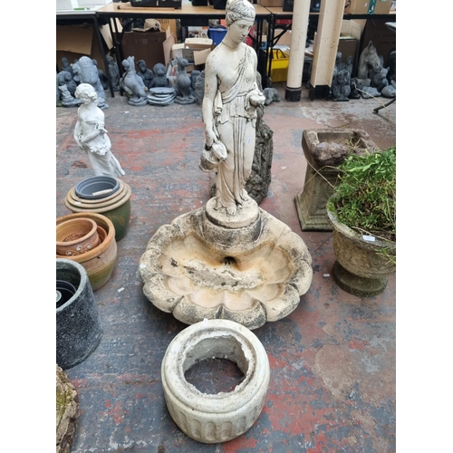 660 - A cast stone garden clamshell and classical lady  birdbath - approx. 102cm high