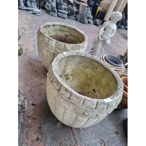 662 - A pair of cast stone barrel type garden planters - approx. 43cm high x 42cm diameter