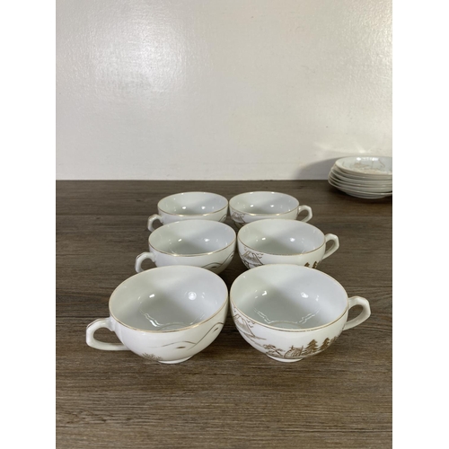 61 - A Japanese twenty two piece lithophane Geisha Girl tea set