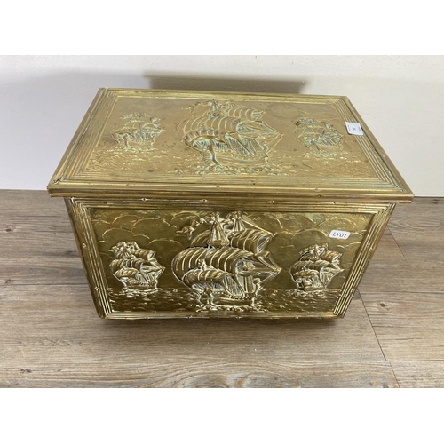 93 - A mid 20th century embossed brass nautical design coal box - approx. 28cm high x 41cm wide x 27cm de... 