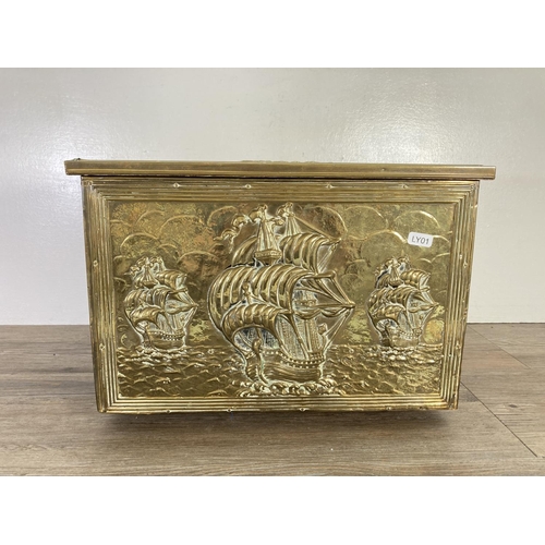 93 - A mid 20th century embossed brass nautical design coal box - approx. 28cm high x 41cm wide x 27cm de... 