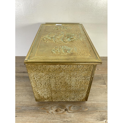 93 - A mid 20th century embossed brass nautical design coal box - approx. 28cm high x 41cm wide x 27cm de... 