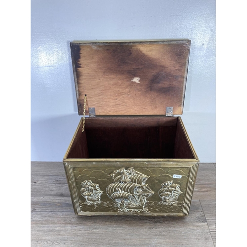 93 - A mid 20th century embossed brass nautical design coal box - approx. 28cm high x 41cm wide x 27cm de... 