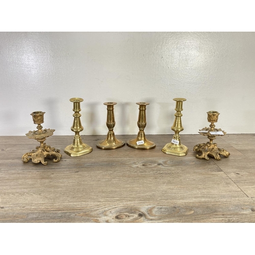 95 - Three pairs of brass candlesticks - largest approx. 17cm high