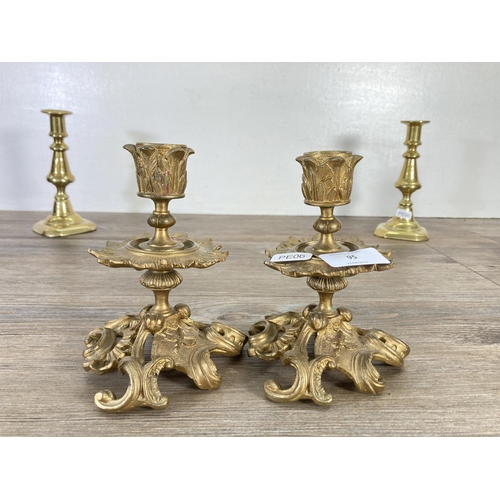 95 - Three pairs of brass candlesticks - largest approx. 17cm high