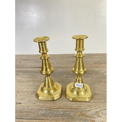 95 - Three pairs of brass candlesticks - largest approx. 17cm high