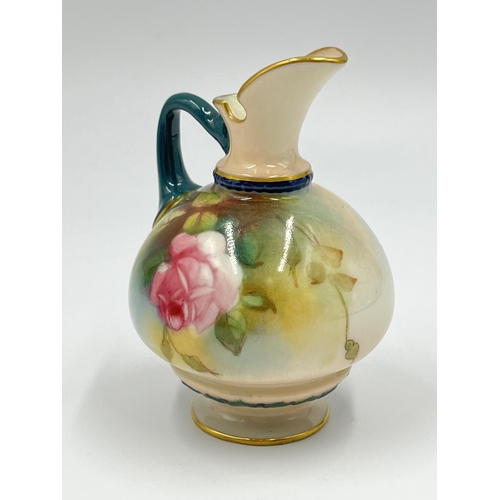 12 - A Royal Worcester hand painted miniature jug with rose design, reference no. 221 H1038 - approx. 9.5... 