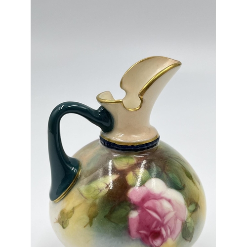 12 - A Royal Worcester hand painted miniature jug with rose design, reference no. 221 H1038 - approx. 9.5... 