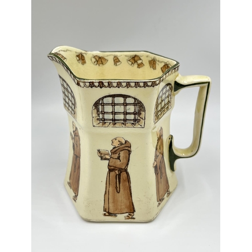 18 - An early 20th century Royal Doulton Monks pattern hexagonal jug, Rd No 479301 - approx. 18cm high