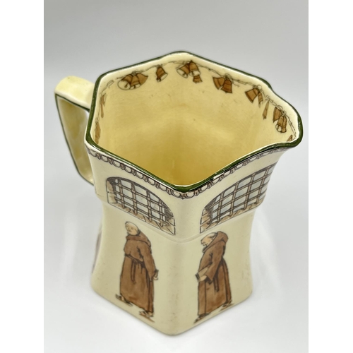 18 - An early 20th century Royal Doulton Monks pattern hexagonal jug, Rd No 479301 - approx. 18cm high