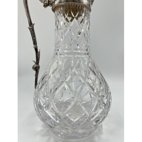 19 - A boxed silver plate and cut glass claret jug - approx. 31cm high