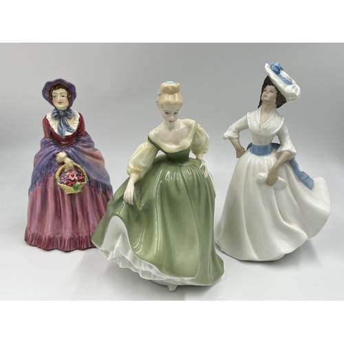 29 - Three ceramic lady figurines, two Royal Doulton and one Made in England