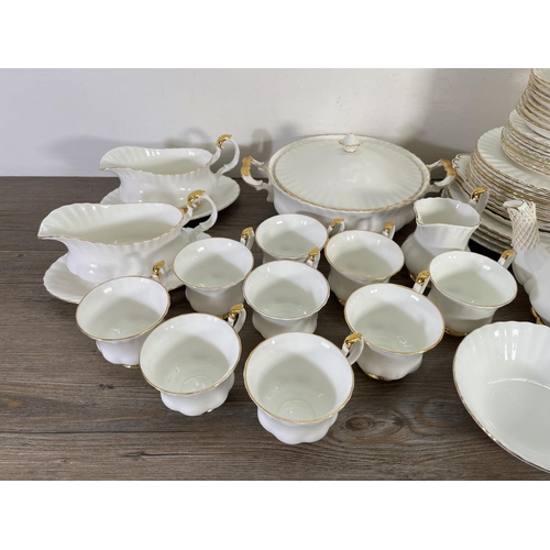 77 - A collection of Royal Albert Val D'or china to include nine cups, teapot, tureen etc.