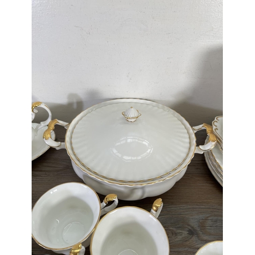 77 - A collection of Royal Albert Val D'or china to include nine cups, teapot, tureen etc.