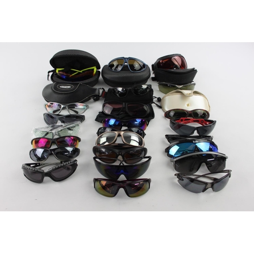 122 - A collection of sports style sunglasses to include BollÃ©, Wind Riders, Police etc.