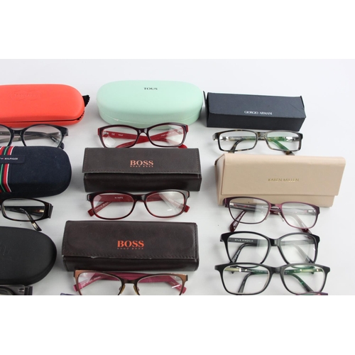 126 - A large collection of branded spectacles to include Hugo Boss, Calvin Klein, FCUK etc.