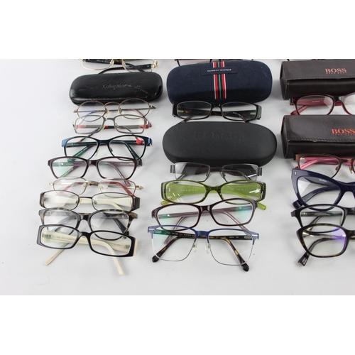 126 - A large collection of branded spectacles to include Hugo Boss, Calvin Klein, FCUK etc.