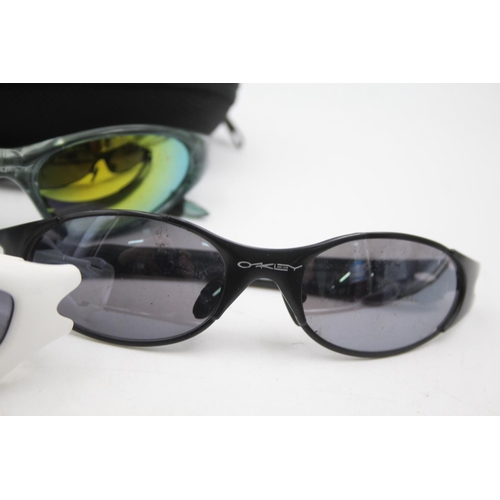 128 - Three pairs of Oakley sunglasses to include Minute, Y2K etc.