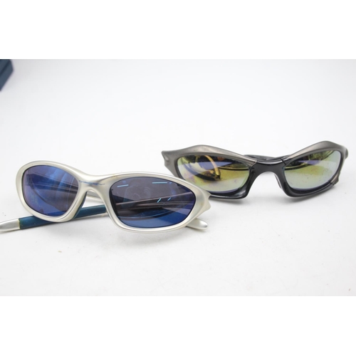 129 - Two pairs of Oakley sunglasses