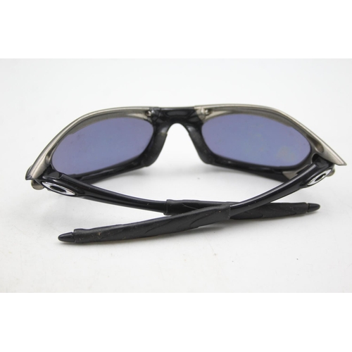 129 - Two pairs of Oakley sunglasses