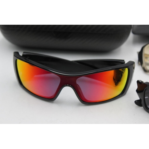 136 - Three pairs of Oakley sunglasses, one Spike, one 4+1 2 and one Batwolf