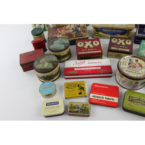 188 - A large collection of vintage advertising tins to include Macintosh, Carrs, Sainsburys etc.