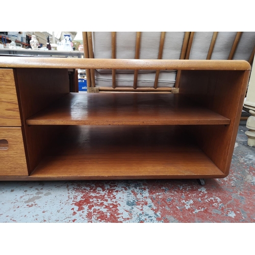 261 - A Meredew teak coffee table/media unit - approx. 44cm high x 120cm wide x 60cm deep