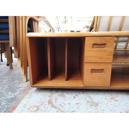 261 - A Meredew teak coffee table/media unit - approx. 44cm high x 120cm wide x 60cm deep