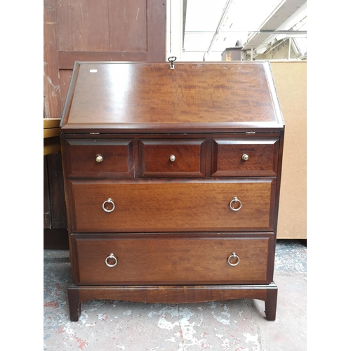 240 - A Stag Minstrel mahogany bureau with three short drawers, two long drawers and fall front