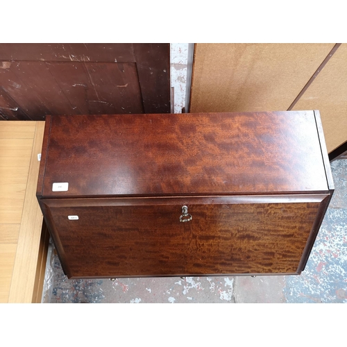 240 - A Stag Minstrel mahogany bureau with three short drawers, two long drawers and fall front