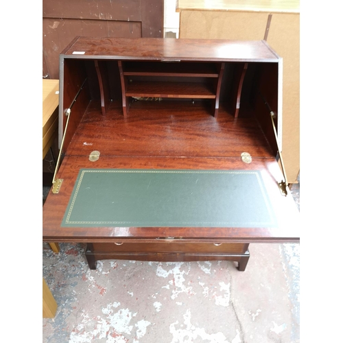 240 - A Stag Minstrel mahogany bureau with three short drawers, two long drawers and fall front